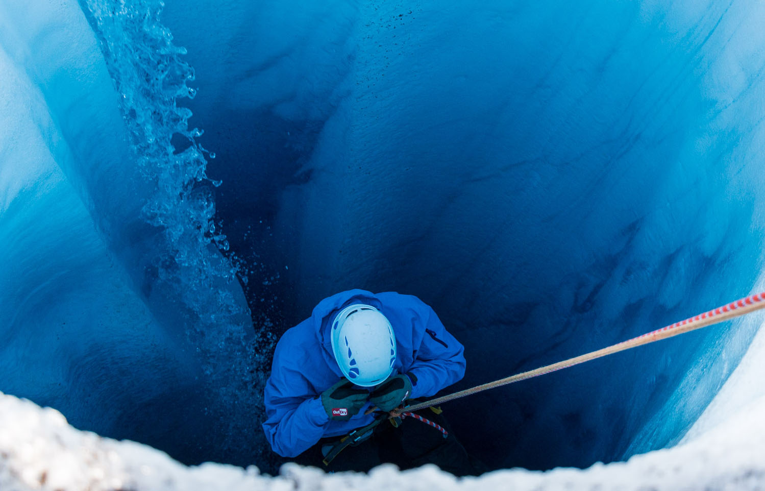 Robert Macfarlane rappelling in Greenland. Photograph: Helen Spenceley