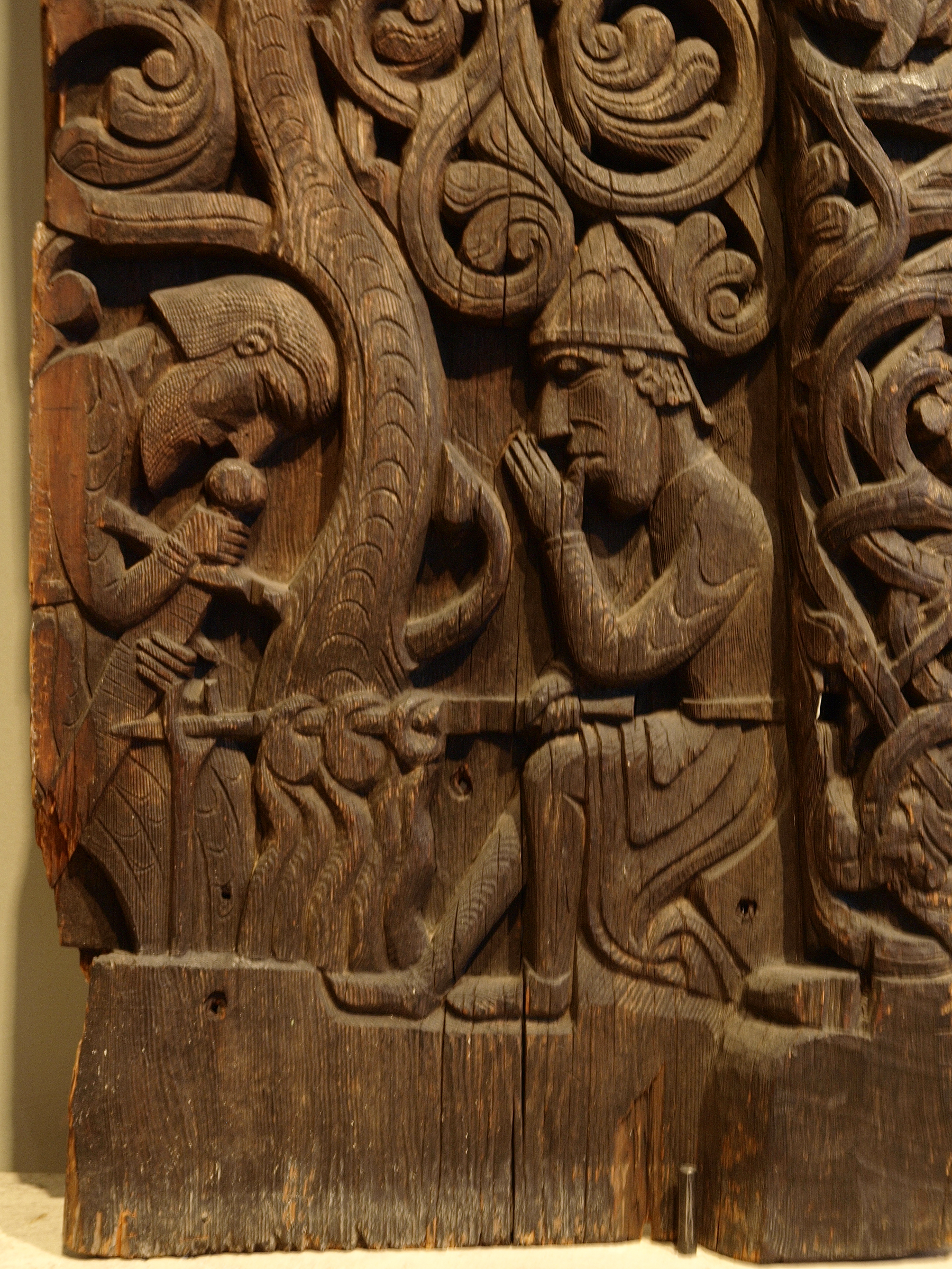 From the Hylestad stavechurch, this scene shows Sigurðr roasting the dragon's heart. After sucking his finger with the blood on, he was able to understand the speech of birds. Photo: Marieke Kuijjer / Wikimedia Commons 
